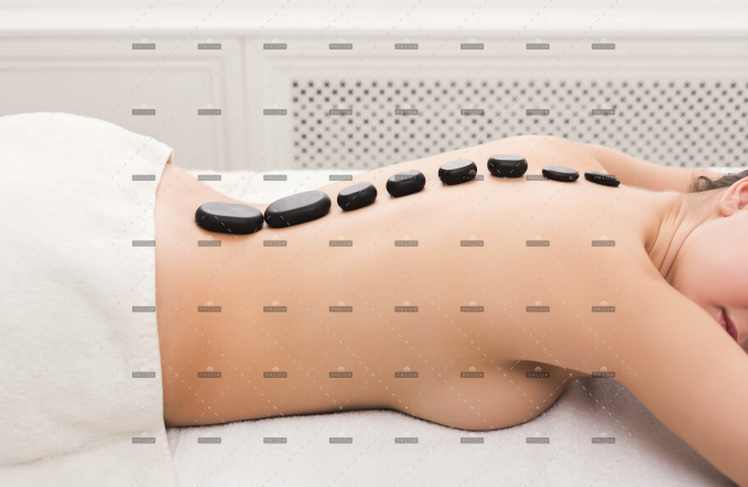 demo-attachment-113-woman-getting-hot-stones-massage-at-spa-salon-5AVNW2T